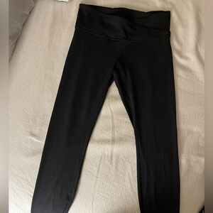 black lululemon leggings, crossed material in front